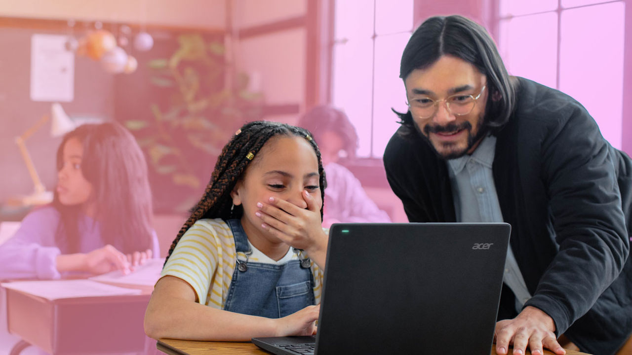 Stylized photo of a teacher helping a young student while she uses her computer